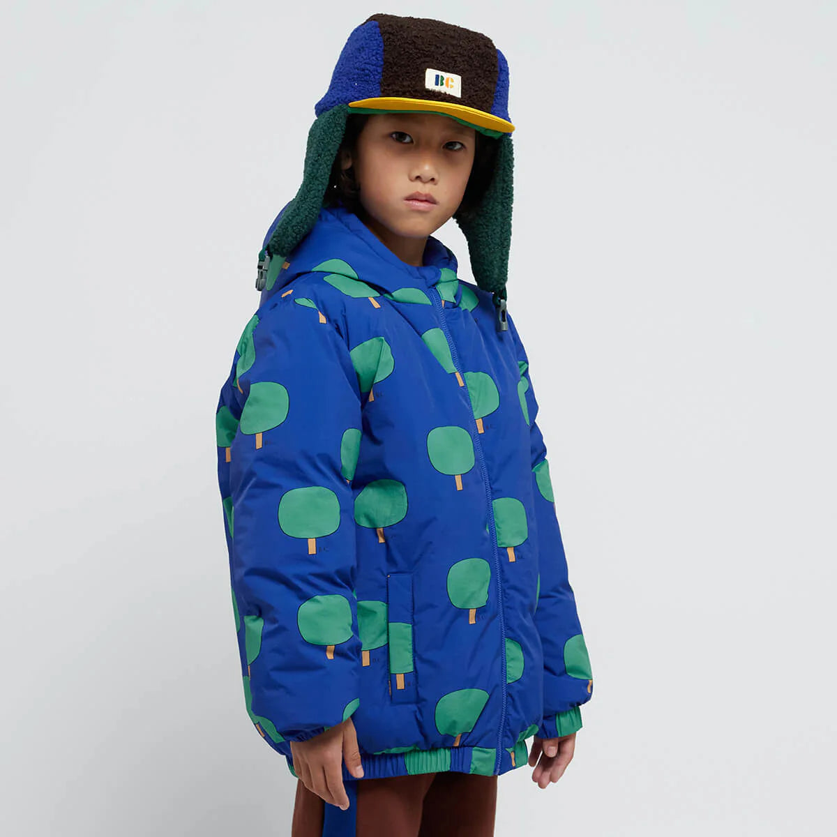 Green Trees All Over Blue Anorak by Bobo Choses