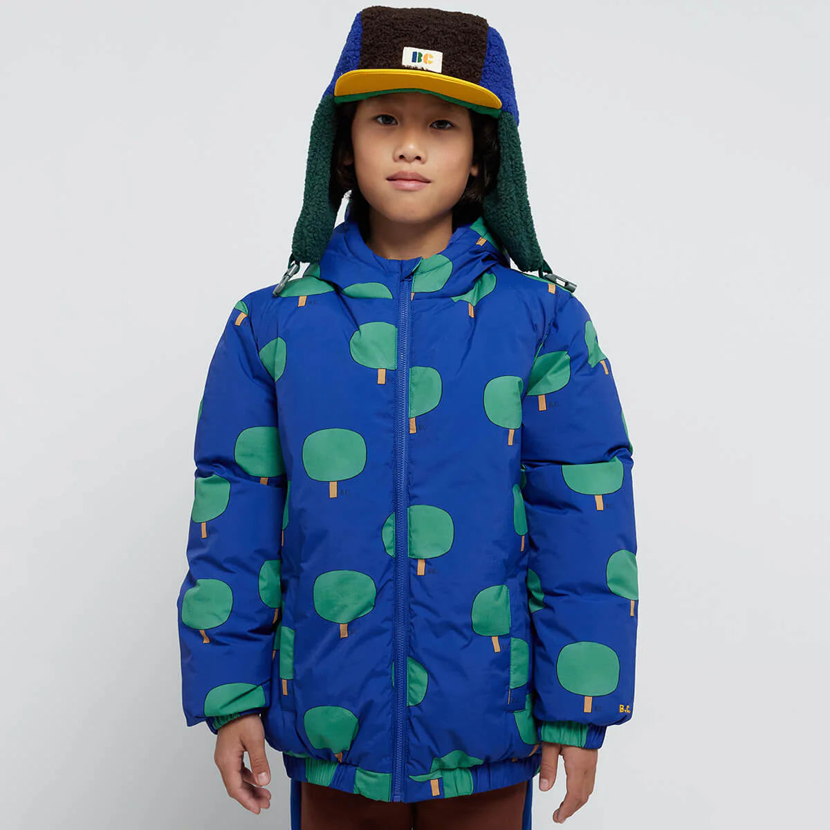 Green Trees All Over Blue Anorak by Bobo Choses